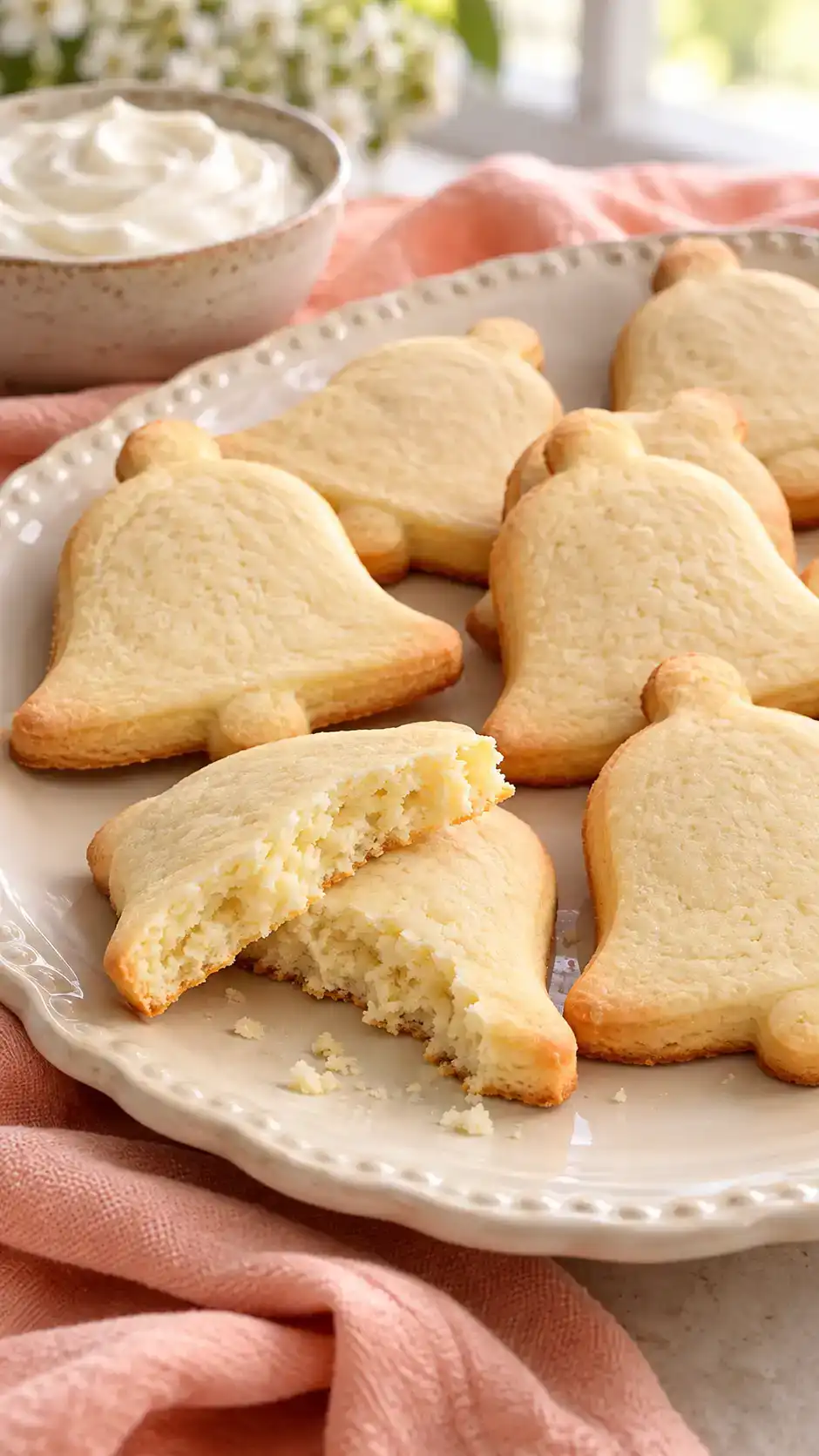 Tender sour-cream sugar-cookie cut-outs with smooth tops and gently raised centers.